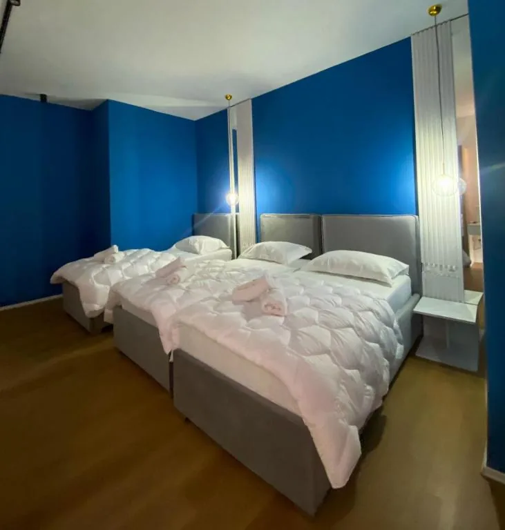 Triple Room with Balcony — Capital Suites Center